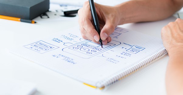 A mobile app developer draws out a plan for a new app