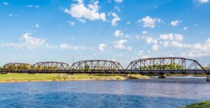 a bridge crosses a river along the oklahoma portion of route 66