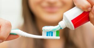 a woman preventing gingivitis