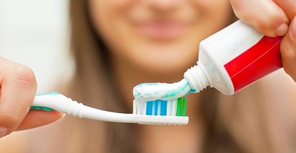 a woman preventing gingivitis