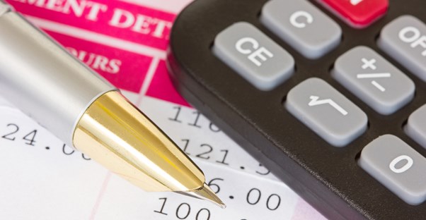 Image of a pen and a calculator