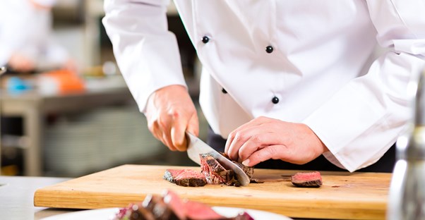 Chef chops up meat