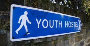 a sign points the way to a dublin hostel