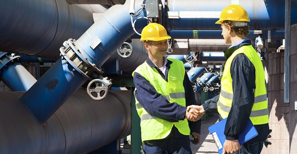 Chemical engineers shake hands