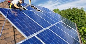 solar panels being installed on a roof