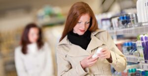 a woman buying deodorant to treat her hyperhidrosis