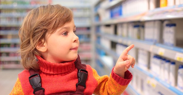 a child who is buying deodorant