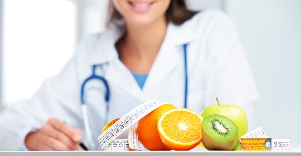 Nutritionist takes measurements of fruit