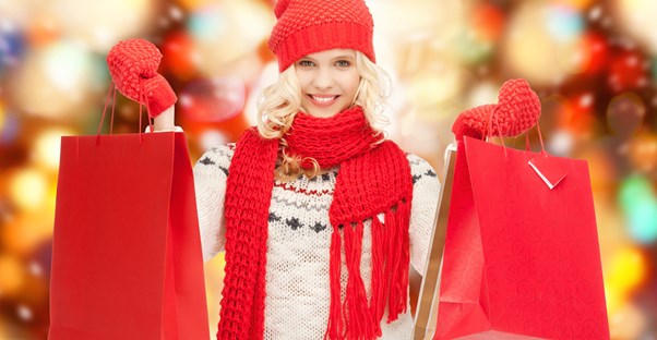 Woman smiling because she stuck to her holiday budget
