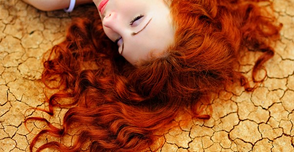 a woman who does not know the difference between dry scalp and dandruff
