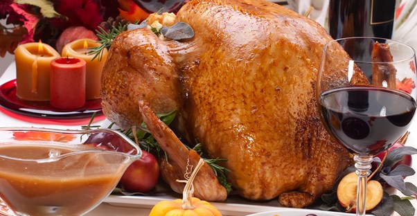 Thanksgiving dinner sitting on a table waiting to be eaten as the family discuss what they are grateful for