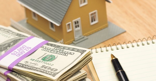 House sitting next to money from a home equity loan