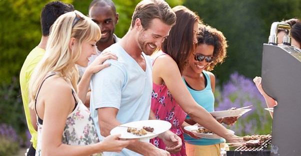 A group of friends enjoying the perfect cookout party.