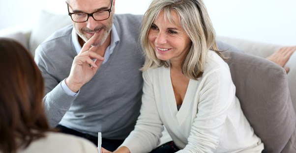 Couple signing up for liability insurance