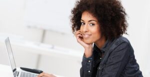 Woman smiling because her company is protected by risk management tools