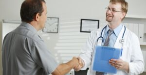 a man who is learning the difference between a colonoscopy and an endoscopy