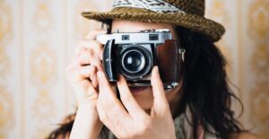 Photography students take pictures in class