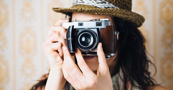 Photography students take pictures in class