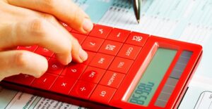 Person Calculating The Tax Benefits of Their 529 Plan