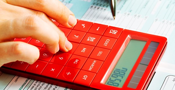 Person Calculating The Tax Benefits of Their 529 Plan