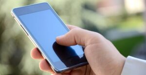 A man using one of the best cell phones on the market