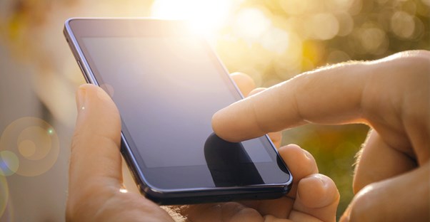 Man uses his newly purchased cell phone
