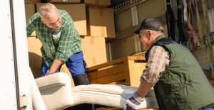 Two men moving their goods out of a storage vault