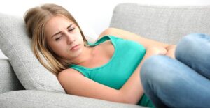 a woman suffering from crohns and ulcerative colitis symptoms