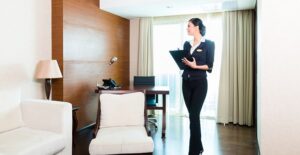 A hospitality manager inspects a hotel room