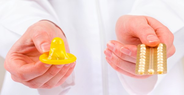 a doctor who is helping a patient choose between contraceptives
