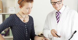 a doctor explaining the negative effects of contraceptives