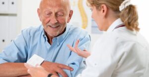 a doctor explaining colonoscopy recovery