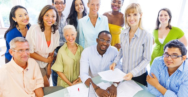 A bunch of social workers gather together for a group picture