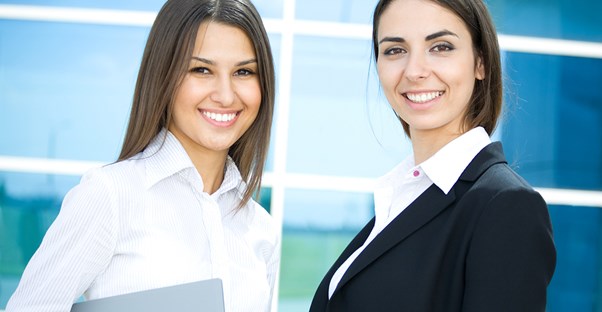 Two social workers smile