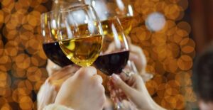 Drinks being toasted at a christmas party