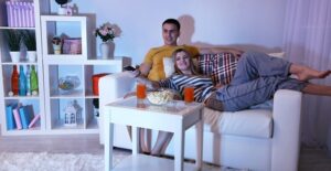 A couple watching an entire tv series on netflix in one weekend.
