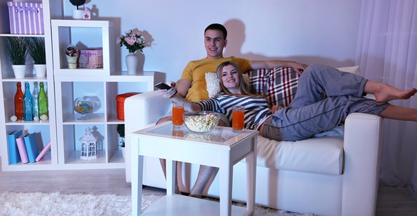 A couple watching an entire tv series on netflix in one weekend.