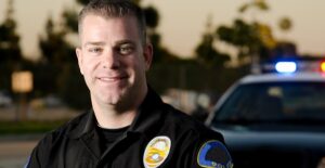A police officer smiles