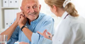 a man who is learning about defibrillator vests