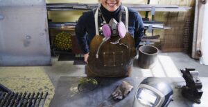 A welder takes a break from work