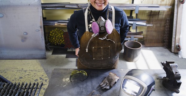 A welder takes a break from work