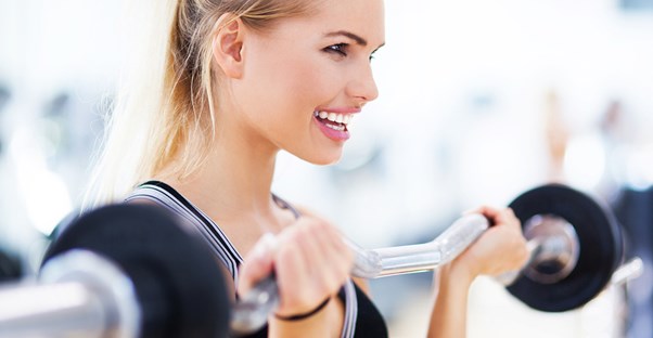 Woman exercising with gym equipment