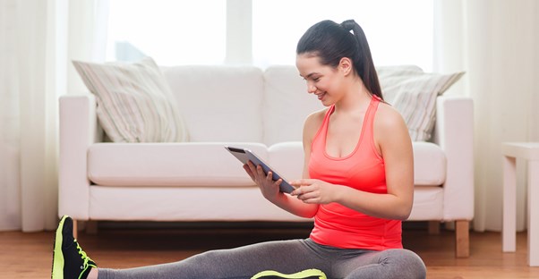 Woman using her small home gym
