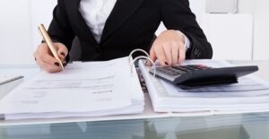 Woman figuring up her 2015 taxes