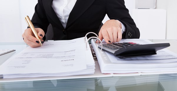 Woman figuring up her 2015 taxes