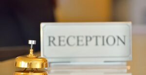 a reception desk and bell at the hotel princess barcelona