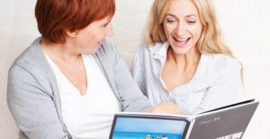 Mother and daughter gush over a family photo book