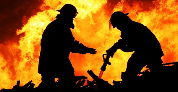 Firefighters work to put out a fire
