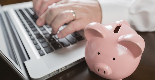Man searching for financial aid for an online college