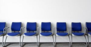 an empty waiting room to see a doctor about genital herpes